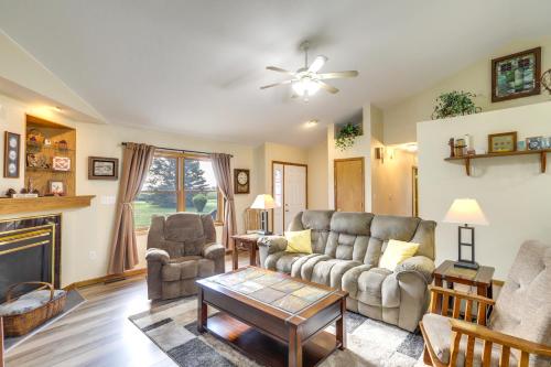a living room with a couch and chairs and a fireplace at Sturgis Home with Yard Less Than 1 Mi to Minnewaukan Lake in Sturgis