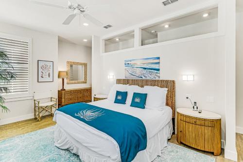 a bedroom with a king sized bed and a bathroom at Sunset Cove at Palmilla Beach in Port Aransas