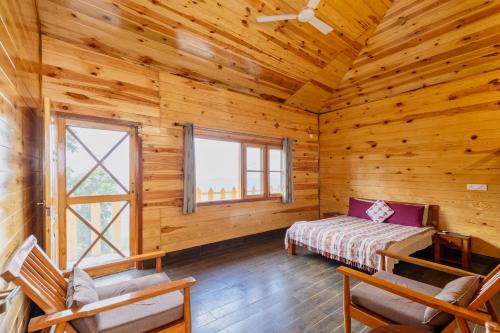 a log cabin with a bed and a window at Villa by Mountain Homes- Lansdowne in Lansdowne
