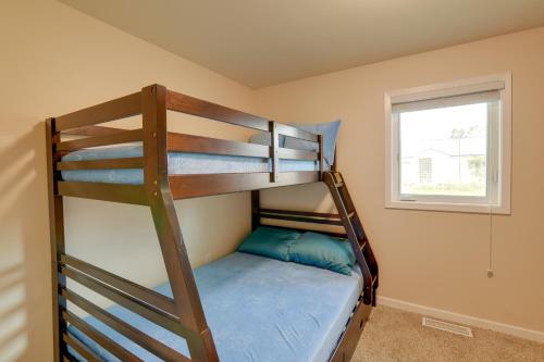 a bedroom with two bunk beds in a room at Downtown Anchorage Vacation Rental with Garden Views in Anchorage