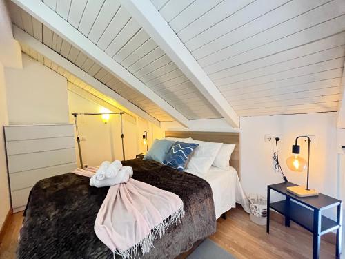 a bedroom with two beds in a attic at Duplex Exterior Madrid Centro Esperanza in Madrid
