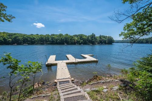 a wooden dock in the middle of a lake at Cedar Ridge in Oakland