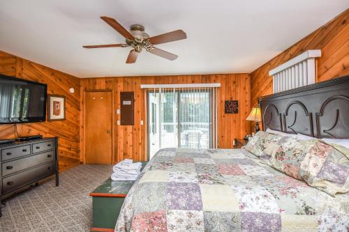 a bedroom with a bed and a ceiling fan at Cedar Ridge in Oakland