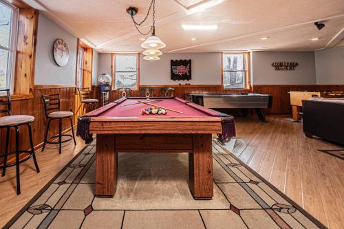 a billiard room with a pool table in it at Sunkissed Lodge in McHenry