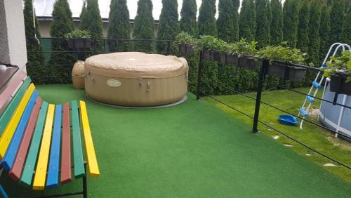 a play area with a barrel and a playground at Chatička na Lipce, Železné hory, Sečská přehrada in Horní Bradlo
