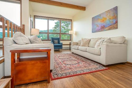 a living room with a couch and a table at Ski Harbor 19 in McHenry