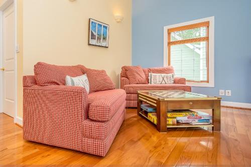 a living room with two chairs and a table at Sunset Cove in Swanton