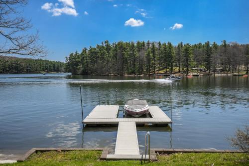 a boat on a dock on a lake at Ski Shore in Swanton