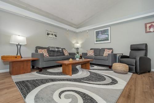 a living room with couches and a rug at Waltzing Matilda in Swanton