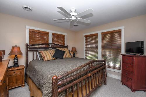 a bedroom with a bed and a ceiling fan at Some Kind of Wonderful in Oakland
