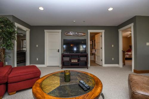 a living room with a coffee table and a tv at Some Kind of Wonderful in Oakland