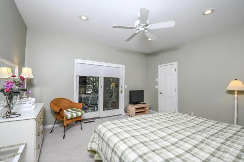 a bedroom with a bed and a ceiling fan at Sunset View in Swanton