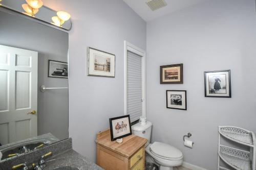 a bathroom with a toilet and a sink at Sunset View in Swanton