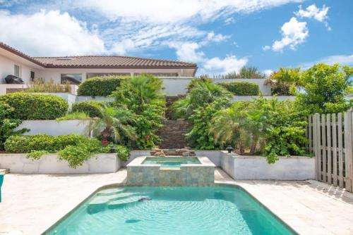 a swimming pool in the backyard of a house at Island Time -- Oceanfront Bliss in Saint Augustine