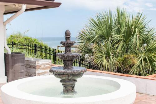 a fountain in the courtyard of a house at Island Time -- Oceanfront Bliss in Saint Augustine