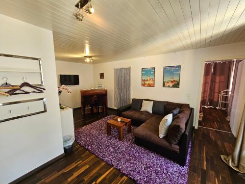 a living room with a couch and a table at La Croix Fédérale in Porrentruy