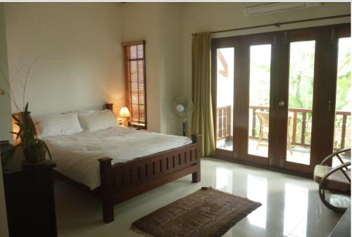 מיטה או מיטות בחדר ב-Mekong Jewel River View