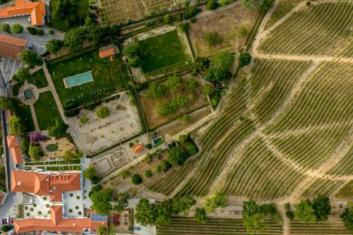 an overhead view of a field with a house at Valverde Santar Hotel & SPA - Relais & Châteaux in Santar