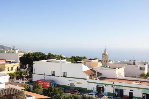an aerial view of a city with buildings at Acogedor ático con vistas al Atlántico in Arafo