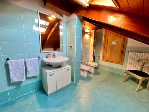 a bathroom with a sink and a toilet at Paradise - nature and wellness in Pino Torinese