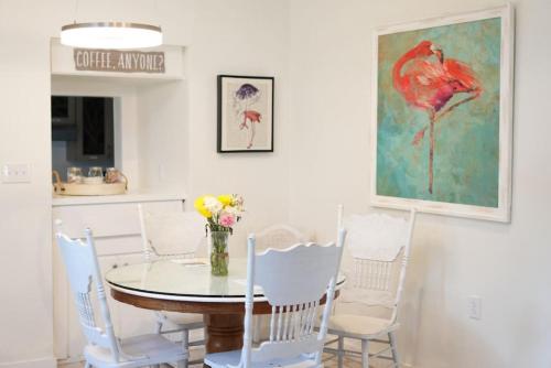 a dining room with a table and chairs at Casa Blanca Casita by the Ocean in St. Augustine