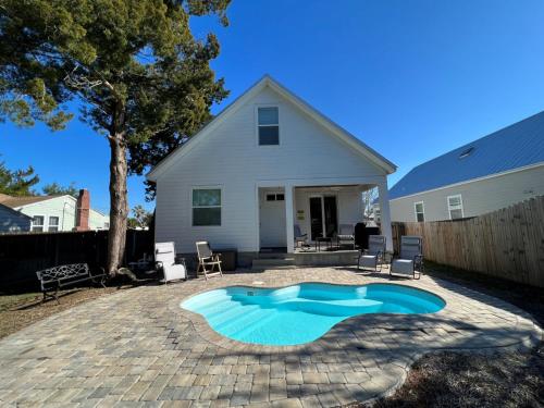 a swimming pool in the backyard of a house at Lions Sail Beach Island Pool in St. Augustine