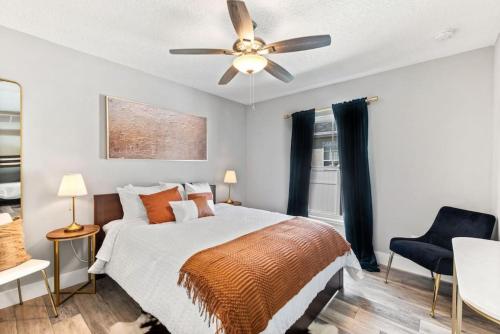 a bedroom with a bed and a ceiling fan at Safar by the Sea in Davis Shores in St. Augustine