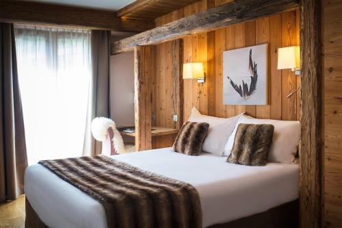 Cama ou camas em um quarto em Au Coeur du Village