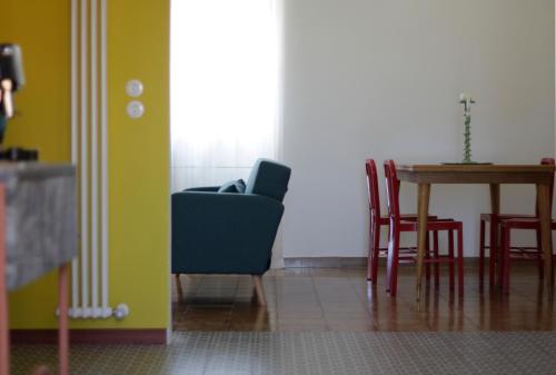 a dining room with a table and chairs at Santa Faustina Holy Apartment in Porto Ercole