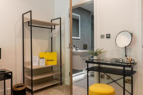 a bathroom with a mirror and a table and a sink at Springfield Thirteen in Harrogate