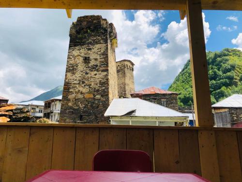a view of a building with a brick chimney at Ela in Ushguli