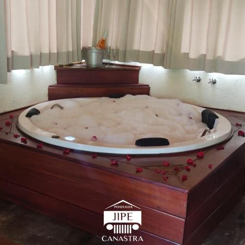 a large bath tub sitting on top of a table at Pousada Jipe Canastra in Capitólio
