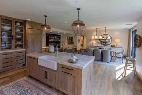 a large kitchen with a sink and a counter at The Snowpine Lodge in Alta