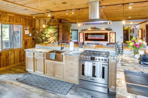 a large kitchen with a stove and a sink at Hot Tub and Mtn Views Epic Stateline Escape! in Stateline