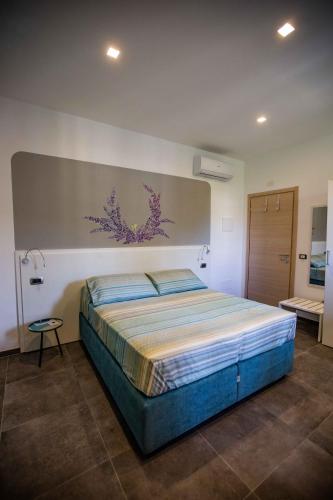 a bedroom with a large bed in a room at Domi Home in La Spezia