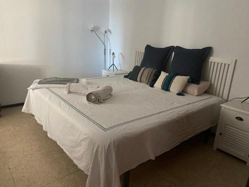 A bed or beds in a room at Playamar Primera linea front beach