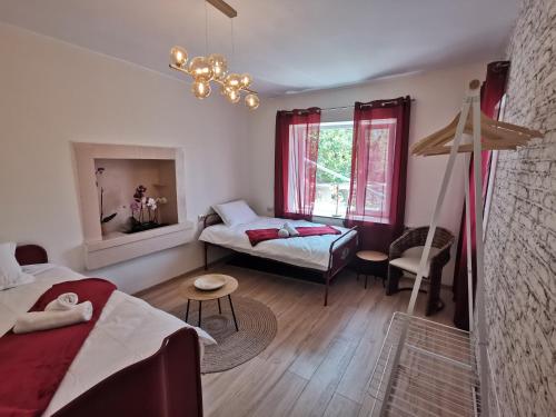 a living room with a bed and a couch at Villa Vin Santo in Vinarovo