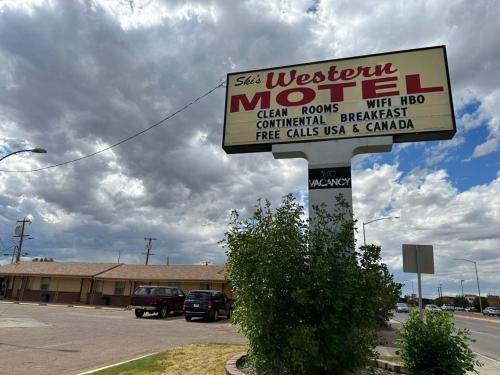 a sign for a store in front of a building at Ski's Western Motel in Great Falls