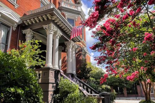a house with a flag on the front of it at Kehoe House, Historic Inns of Savannah Collection in Savannah