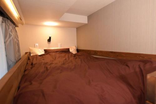Tempat tidur dalam kamar di Hotel Tokyo Hub - Vacation STAY 27674v