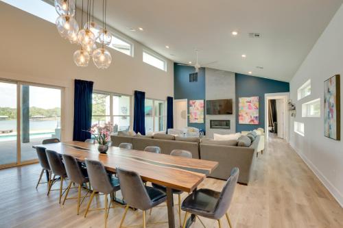 a dining room and living room with a table and chairs at On Cedar Creek Reservoir Malakoff Home with Pool! in Malakoff