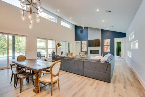 a living room with a table and a couch at Outdoor Oasis Family Malakoff Gem on Cedar Creek! in Malakoff