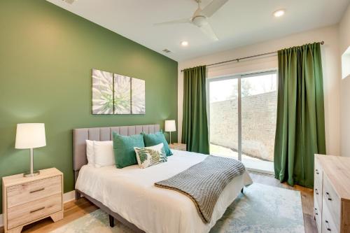 a bedroom with a bed with green walls and a window at Outdoor Oasis Family Malakoff Gem on Cedar Creek! in Malakoff