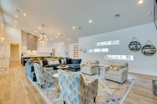 a living room with couches and a kitchen at Luxe Waterfront Home in Malakoff with Pool! in Malakoff