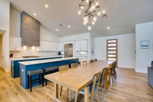 a large kitchen with a wooden table and chairs at Luxe Waterfront Home in Malakoff with Pool! in Malakoff