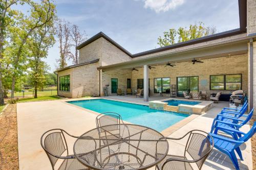 an exterior view of a house with a swimming pool at Outdoor Oasis Family Malakoff Gem on Cedar Creek! in Malakoff