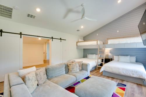 a living room with two beds and a couch at Luxe Waterfront Home in Malakoff with Pool! in Malakoff