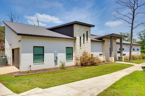 a white house with a black roof at On Cedar Creek Reservoir Malakoff Home with Pool! in Malakoff