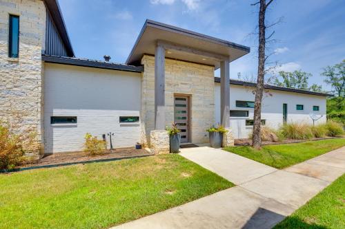 a home with a stone building with a driveway at On Cedar Creek Reservoir Malakoff Home with Pool! in Malakoff