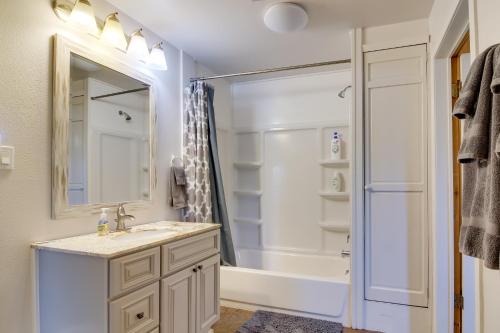 a bathroom with a sink and a shower at Bandon Home with Patio, Steps to South Jetty Park in Bandon